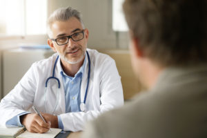 doctor talking to patient in the office