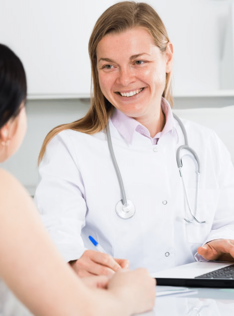 Doctor smiling while talking to a patient